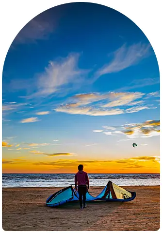 Kite camp on the beach at sunset