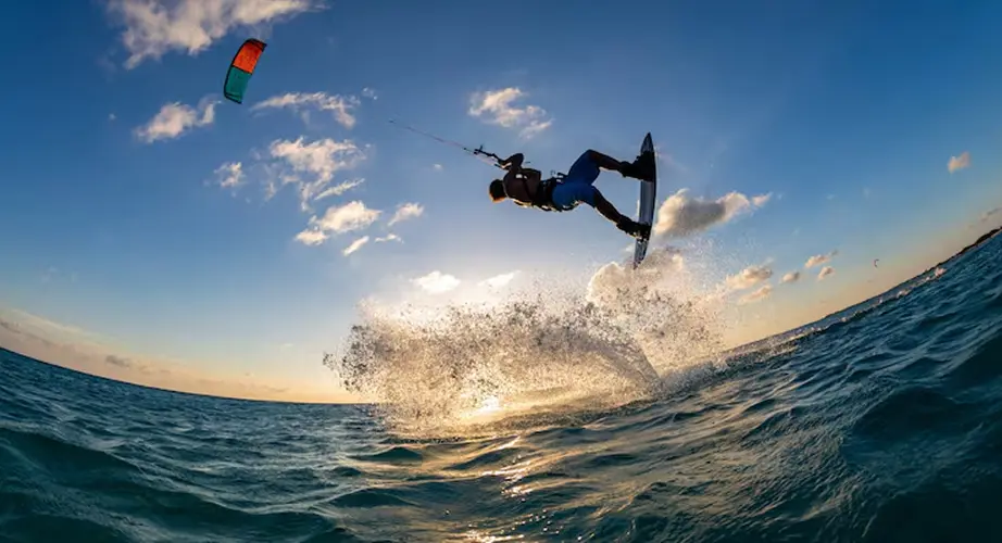 Kitesurfer jumping at sunset over the Red Sea
